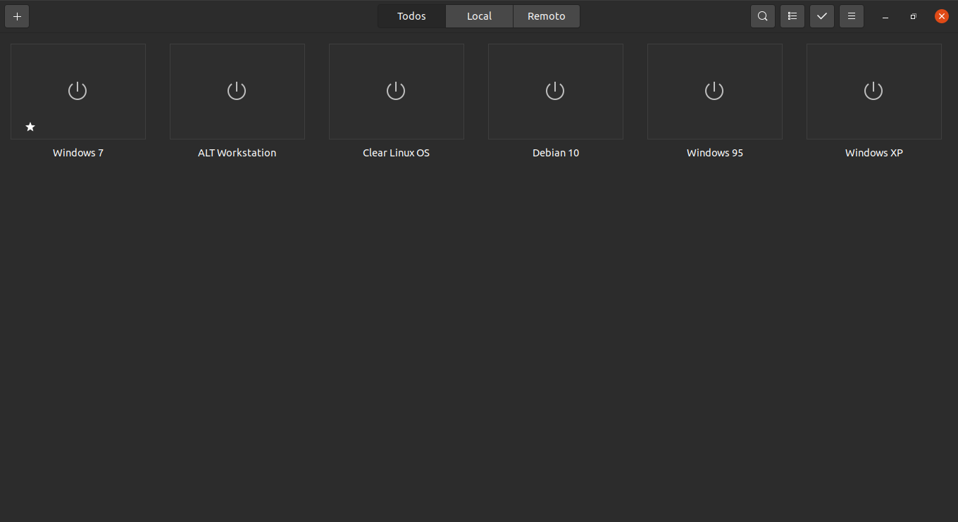 Interface principal da aplicação gnome-boxes com seis máquinas virtuais já instaladas: Windows 7, ALTWorkstation, Clear Linux OS, Debian 10, Windows 95 e Windows XP. Há um botão com o sinal de mais no canto superior esquerdo, três botões centrais (Todos, Local e Remoto) no topo da página e quatro botões no canto superior direito (lupa, lista, checagem e menu) contendo os as ferramentas do sistema. Abaixo da barra superior estão as máquinas virtuais desligadas de forma retangular alinhadas horizontalmente.